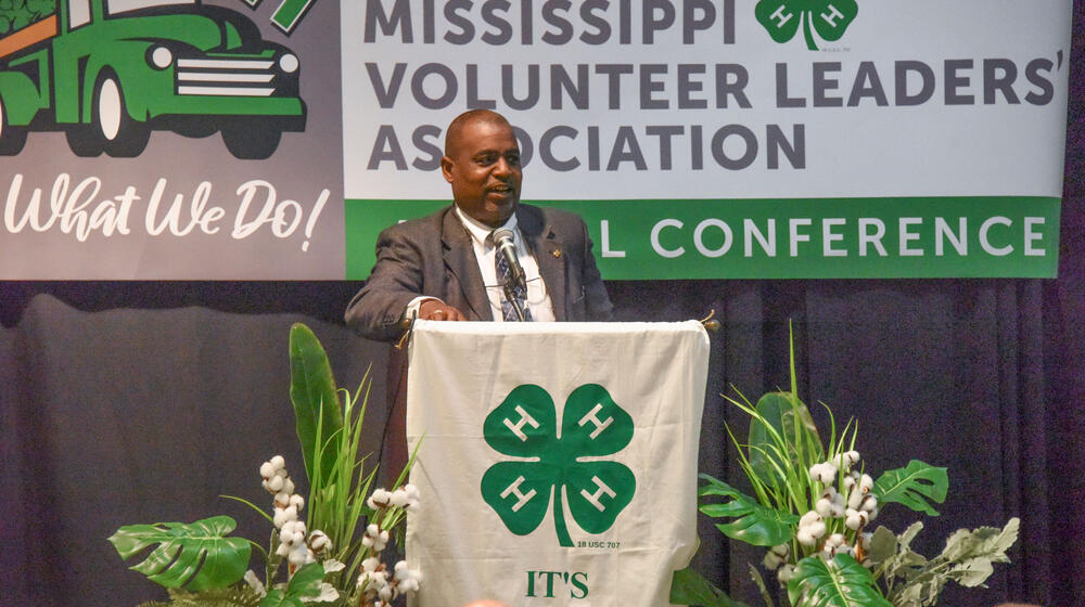A man speaking at a podium.