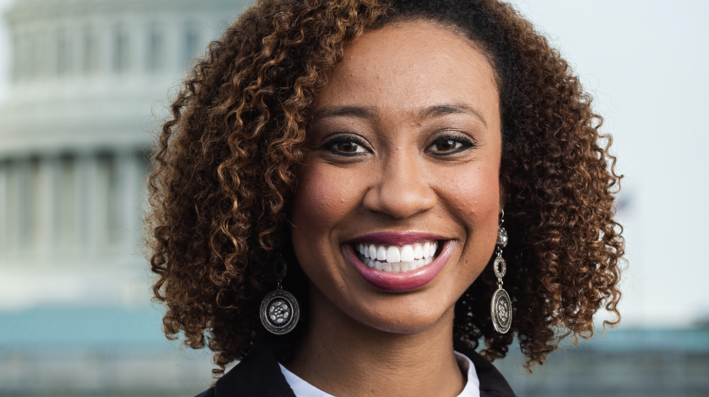 Headshot of a young black woman in business attire.