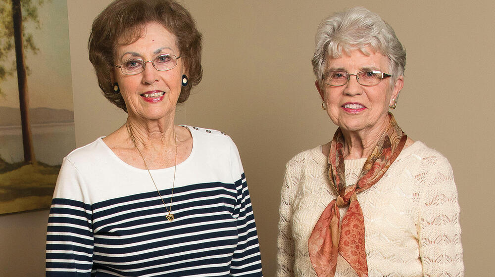 Two women philanthropists smiling.