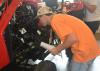 Rankin County 4-H member Robert Herrington takes a close look under the hood of a tractor as he identifies engine parts during a portion of the tractor competition on June 1, 2017. More than 700 4-H members took part in contests, workshops, tours and entertainment during their annual state meeting at Mississippi State University. (Photo by MSU Extension Service/Linda Breazeale)