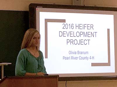 Girl presenting her 2016 heifer development project.